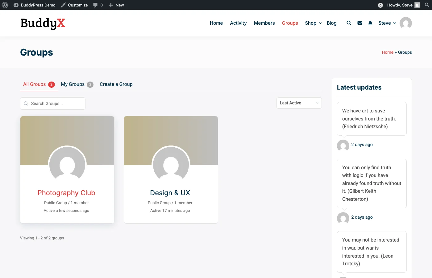 BuddyPress Groups Directory showing Photography Club and Design & UX groups with member counts and activity status