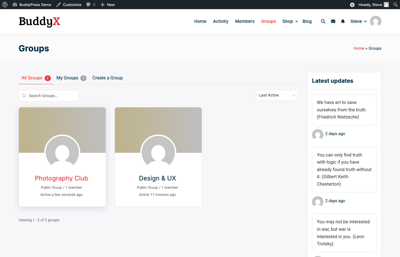 BuddyPress Groups Directory showing Photography Club and Design & UX groups with member counts and activity status
