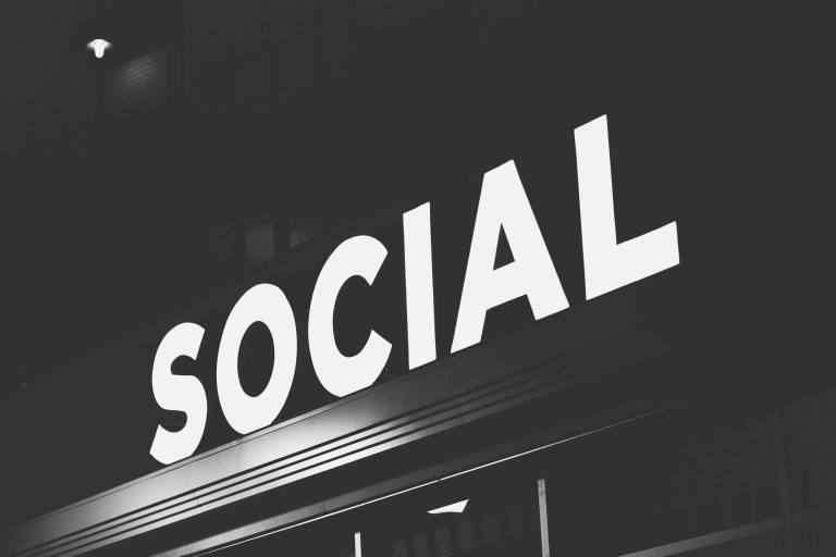 Social network community monetization concept - neon Social sign at night