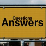 Questions and answers signpost representing a Q&A knowledge base on WordPress