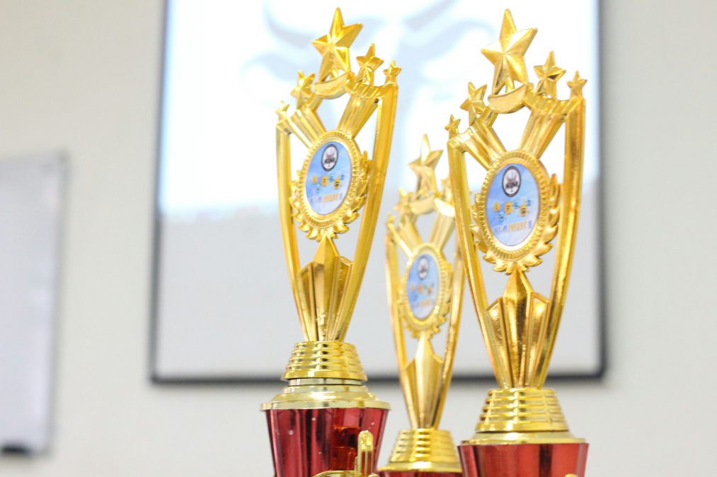 Champion trophies representing reputation rewards and achievements for top forum community members