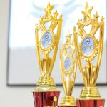 Champion trophies representing reputation rewards and achievements for top forum community members