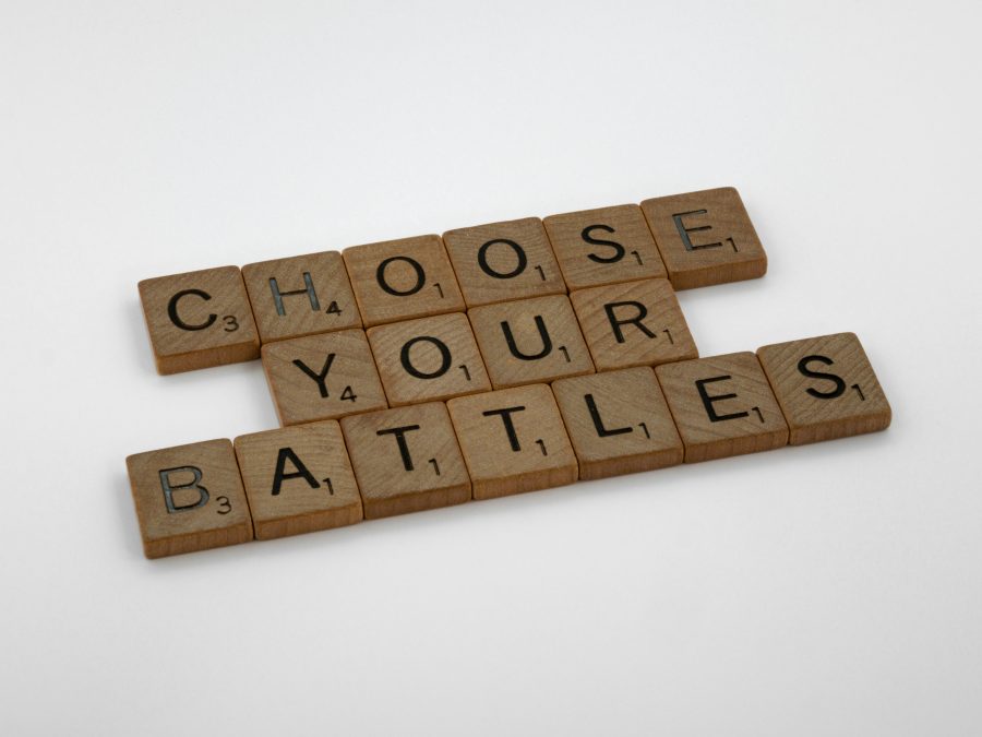 Scrabble tiles spelling Choose Your Battles representing community voting on product roadmap ideas