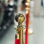 VIP velvet rope line representing invite-only exclusive forum spaces for premium community members